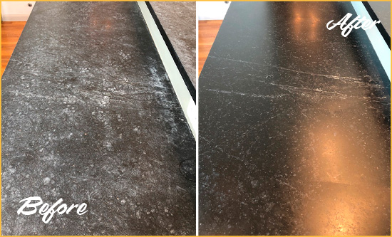 Sir Grout Hones this Worn-Out Stone Countertop for a Smooth Finish Picture of Black Worn-Out Stone Countertop Before and After Honing